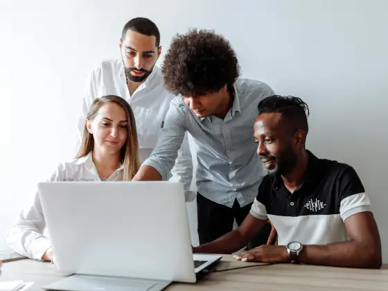 People collaborating on a laptop design session